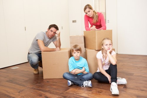Professional movers handling furniture in Balham property
