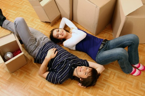 Team member wearing PPE while handling furniture safely